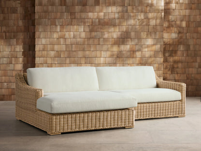 Montauk Outdoor Two-Piece Sectional with cream cushions, light tan woven resin wicker, and left-facing chaise.