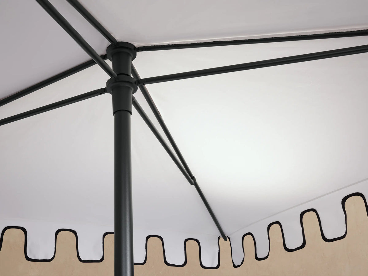 Nata Outdoor Square Scalloped Umbrella, close-up angled view. White canopy with distinctive black scalloped edge and dark finial.