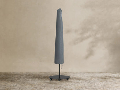 Underside of Nata Outdoor Round Scalloped Umbrella, showing cream canopy, black metal pole, ribs, and scalloped trim.