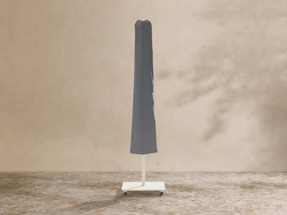 White Nata 79" Outdoor Square Umbrella, fully open, centered against a beige textured wall.