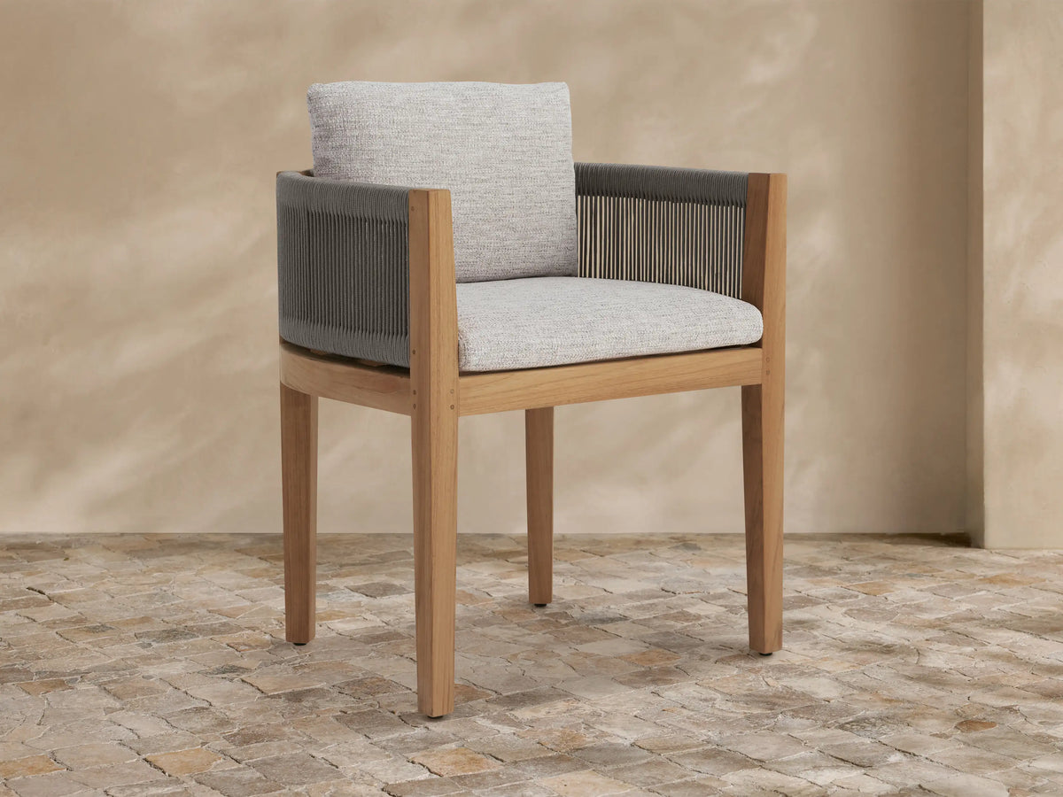 Newport Outdoor Dining Arm Chair, Shardai Zinc, with natural teak frame, dark grey woven rope arms, and light grey seat & back cushions.