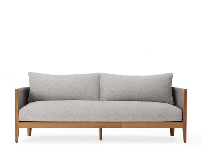 Side view of the Newport Outdoor Sofa showcasing a handwoven grey polyester rope frame on natural teak wood, with a plush grey cushion.