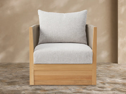 Newport Outdoor Lounge Chair with natural teak frame, dark brown woven sides, and light gray cushions, on a tiled patio.