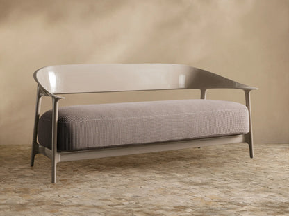 Nia Outdoor Sofa, light taupe, front view. Sleek, glossy curved frame with a textured gray-brown patterned cushion.