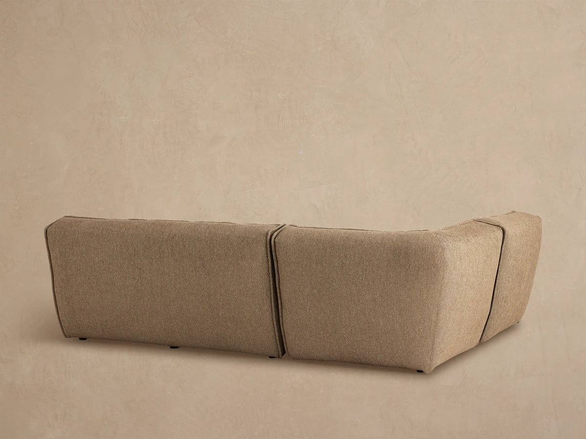 Porto three piece sectional in dark beige fabric with channel stitching