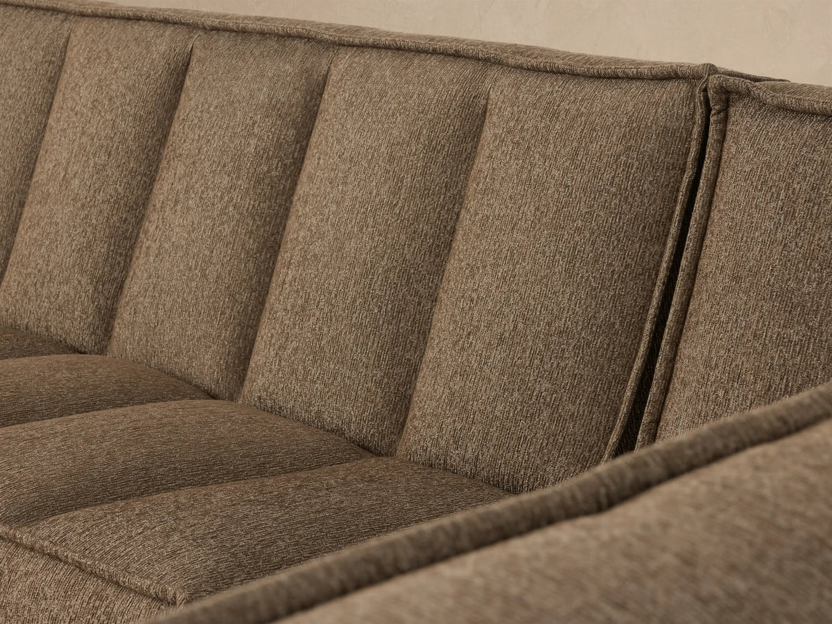 Porto three piece sectional in dark beige fabric with channel stitching