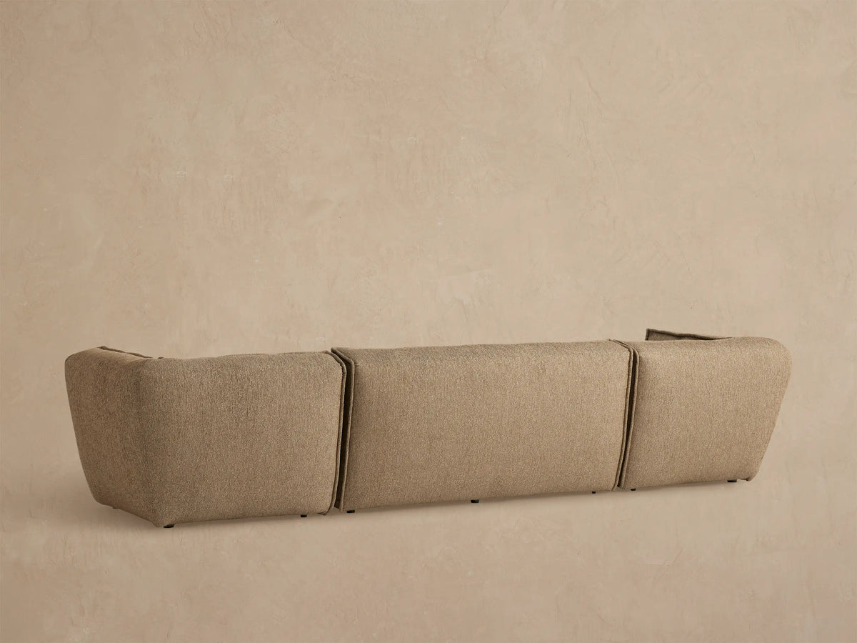 close up of Porto three piece sofa in dark beige fabric with channel stitching