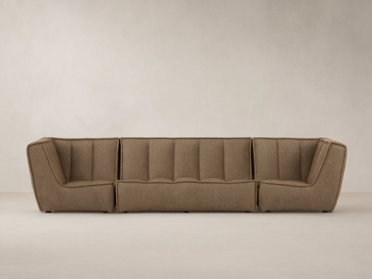 Porto three piece sofa in dark beige fabric with channel stitching