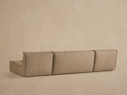 Close up of Porto three piece double chaise sectional in dark beige fabric with channel stitching