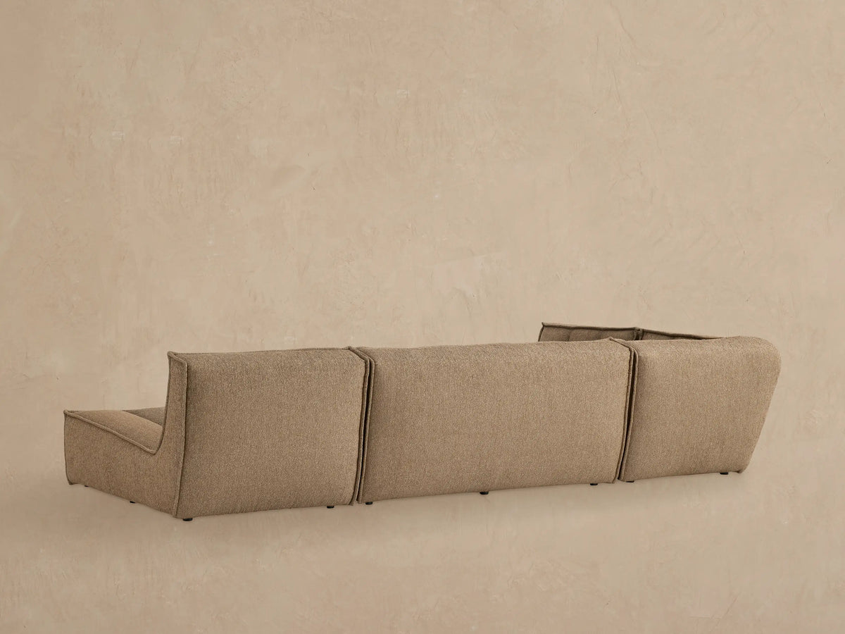 Close up of Porto three piece chaise sectional in dark beige fabric with channel stitching