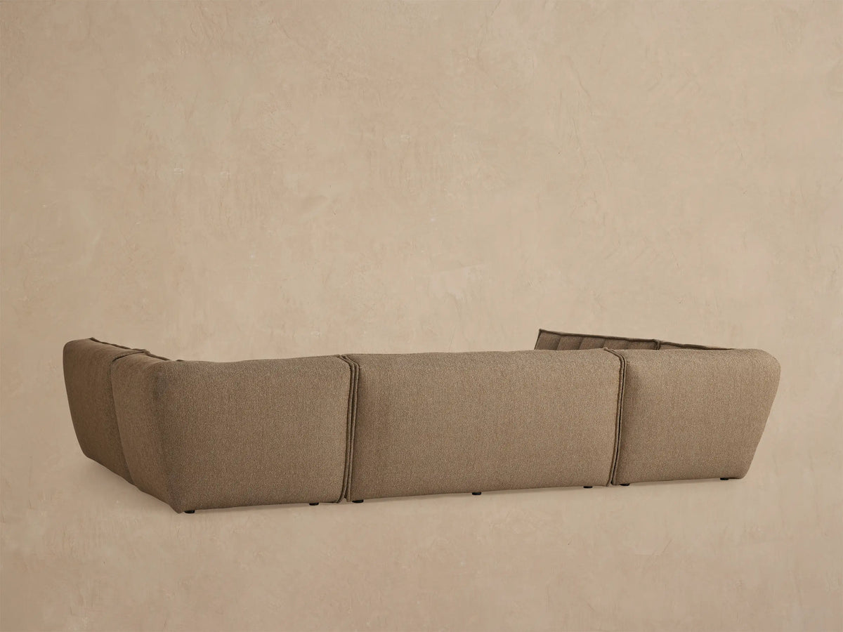 Close up of Porto five piece sectional in dark beige fabric with channel stitching