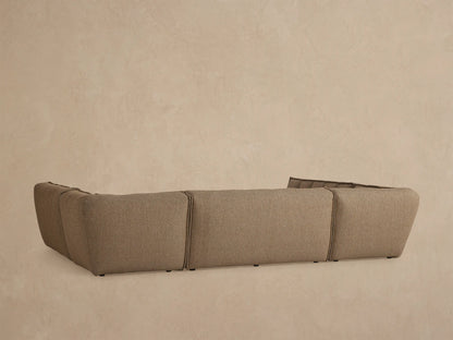 Close up of Porto five piece sectional in dark beige fabric with channel stitching