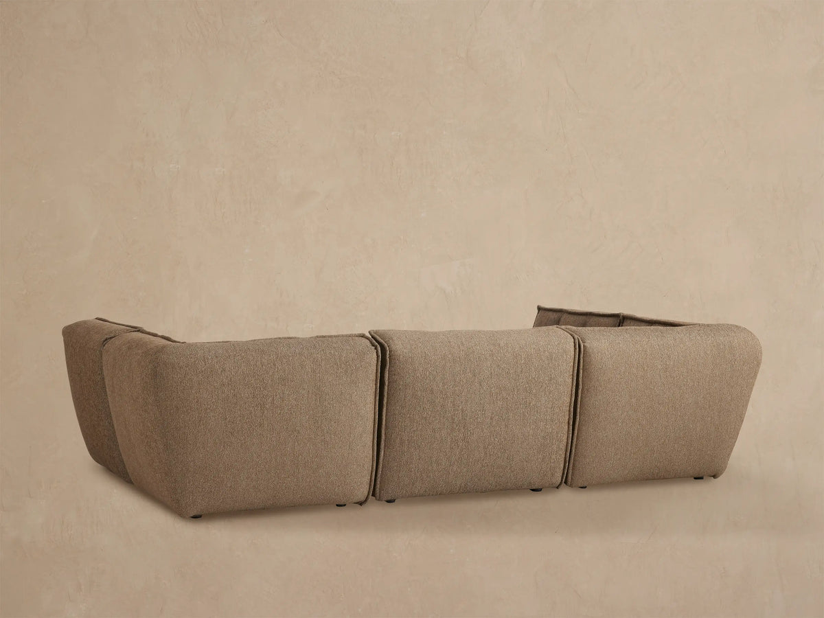 Porto six piece sectional in dark beige fabric with channel stitching