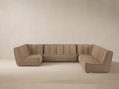 Porto six piece sectional in dark beige fabric with channel stitching