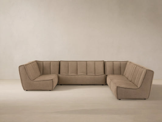Porto six piece sectional in dark beige fabric with channel stitching