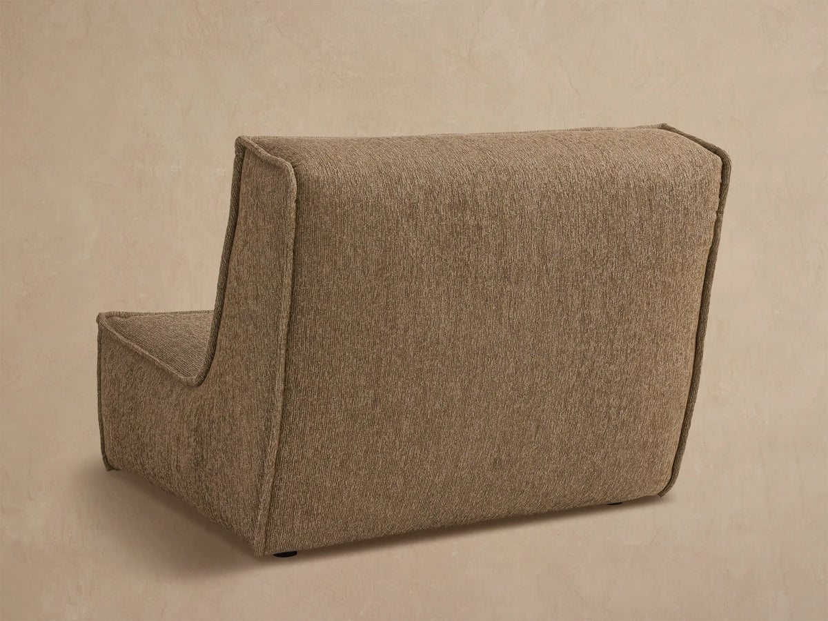 Close up of Porto armless chair in dark beige fabric with channel stitching