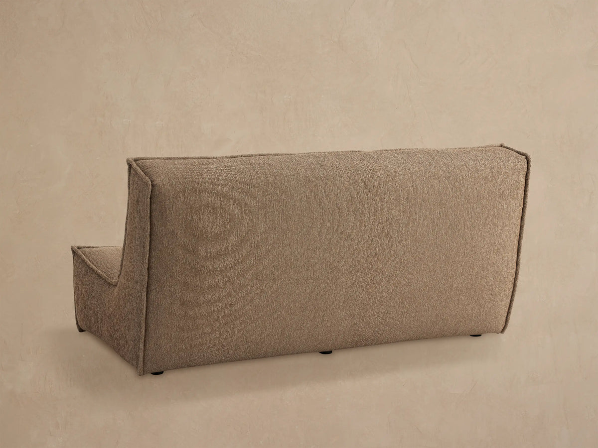 Close up of Porto armless sofa in dark beige fabric with channel stitching