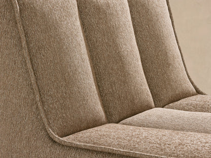 Side view of Porto armless chaise in dark beige fabric with channel stitching