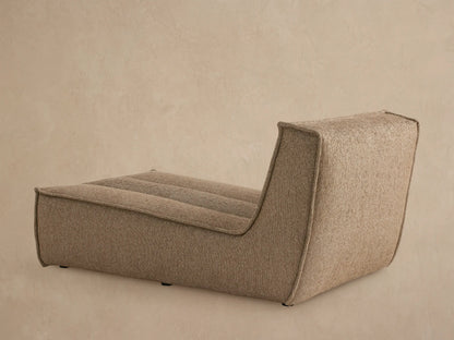 Close up of Porto armless chaise in dark beige fabric with channel stitching