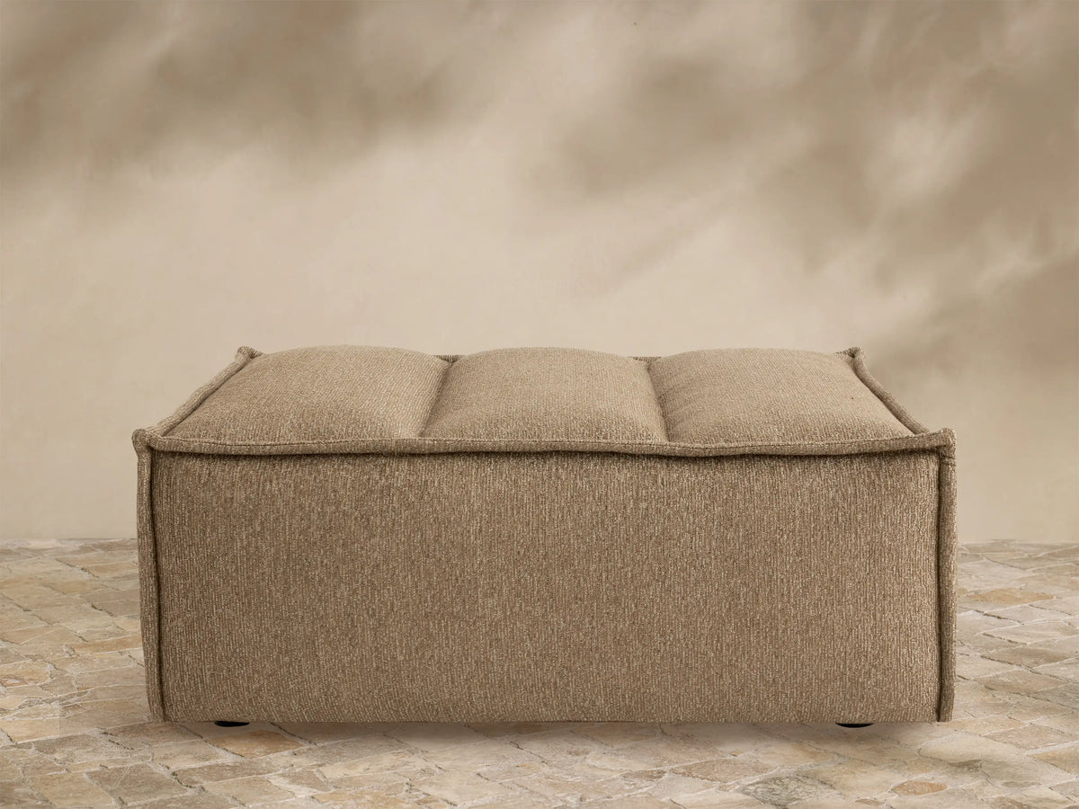 Porto ottoman in dark beige fabric with channel stitching