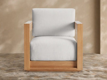 Puebla Outdoor Water-Repellent Replacement Cushions: Light grey seat and back cushions on a wooden outdoor armchair.