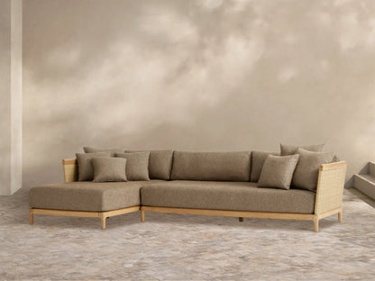 Puglia Outdoor Teak Two-Piece Sectional with Chaise. L-shaped, light teak frame with woven ends, textured brown cushions.