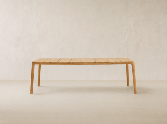 Puglia Outdoor Teak Dining Table, long rectangular light natural teak wood table with slatted top and sturdy legs.