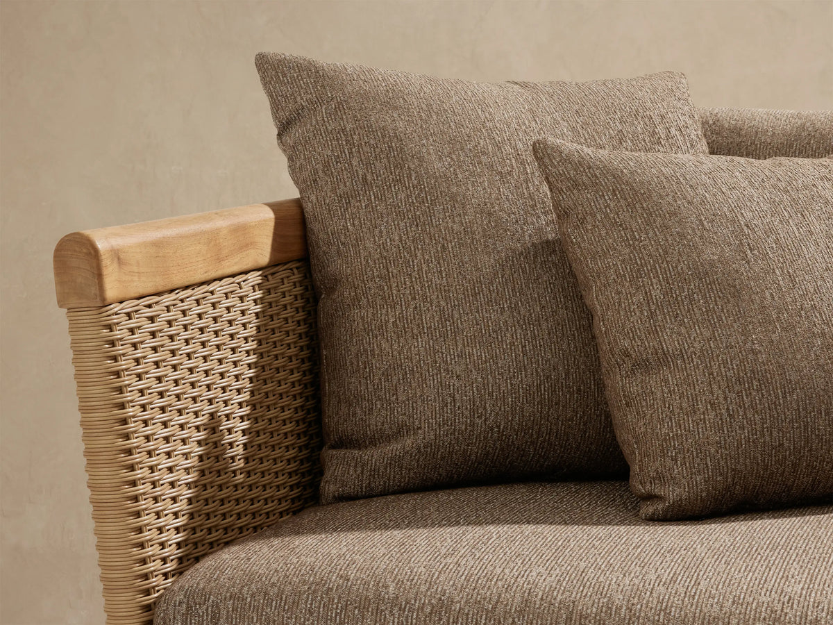 Puglia Outdoor Teak Two-Piece Sectional: L-shaped sofa with light teak wood frame, woven sides, and brown fabric cushions.