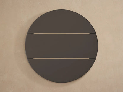 Close-up of a black, round Puglia Outdoor Aluminum End Table with a slatted, textured, powder-coated top.