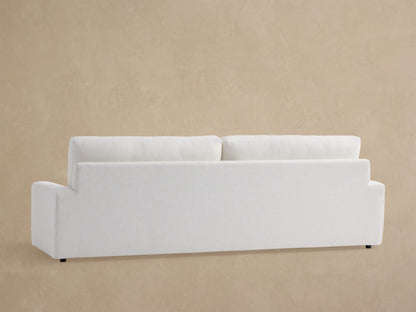 Remington Outdoor Sofa. Close-up of textured Eden Snow fabric on white back cushion and armrest.