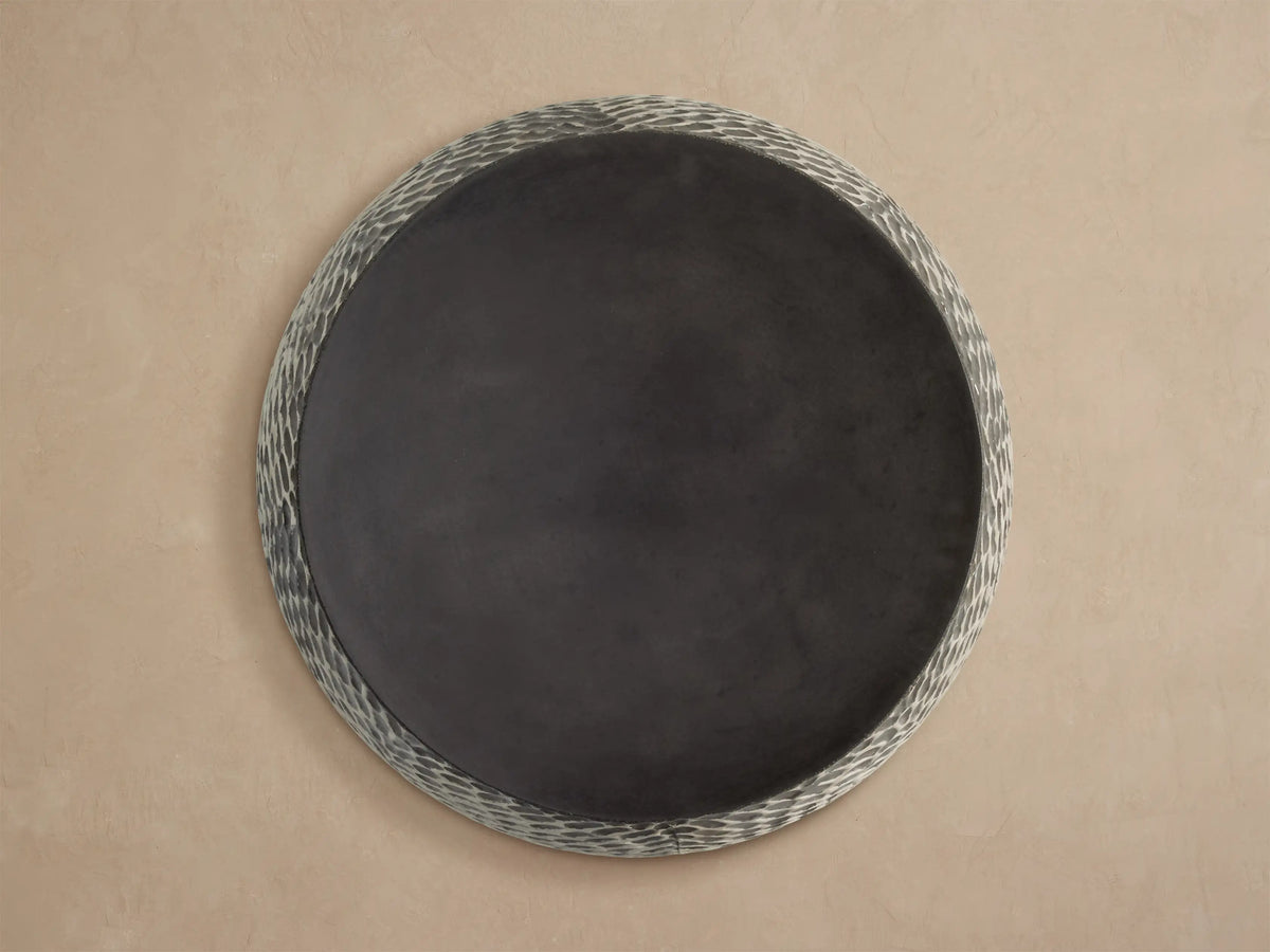 Roche Outdoor End Table with smooth dark gray top & textured sides, dark gray oval pattern on light gray.