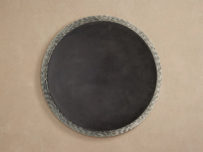 Roche Outdoor End Table with smooth dark gray top & textured sides, dark gray oval pattern on light gray.
