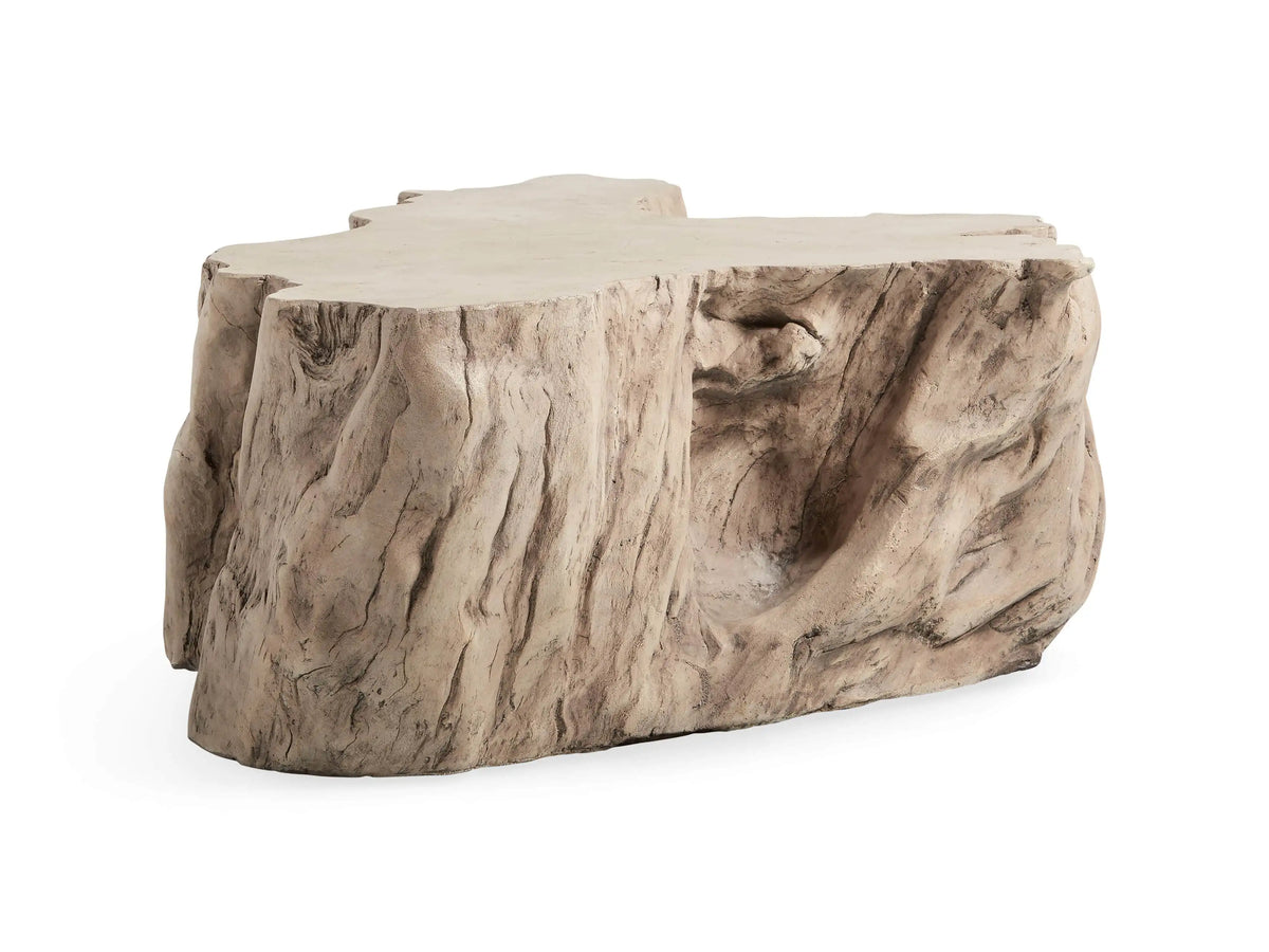 Root Outdoor Bleached Coffee Table resembling a natural tree root, in light beige with textured bark-like details, on a white background.