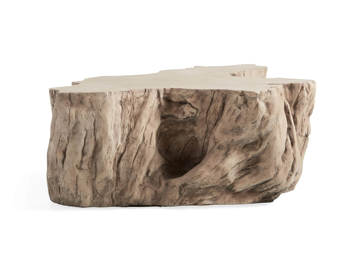 Root Outdoor Bleached Coffee Table in concrete, shaped like a tree root with a smooth, glass-like surface and natural texture.