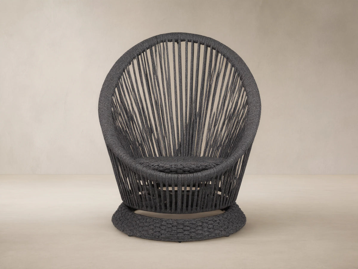Dark gray Sevilla Outdoor Swivel Chair, round high-back design, woven polyester rope with vertical patterns, textured swivel base.