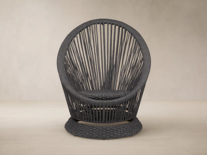 Dark gray Sevilla Outdoor Swivel Chair, round high-back design, woven polyester rope with vertical patterns, textured swivel base.