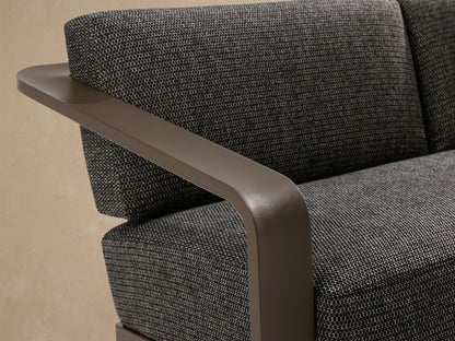 Sonoma Outdoor Aluminum Sofa with dark gray cushions and a bronze-colored aluminum frame, angled right on a tiled patio.
