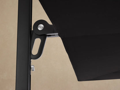 Spectra Outdoor Umbrella, black canopy shown horizontally closed, attached to a black support pole on the left against a neutral wall.