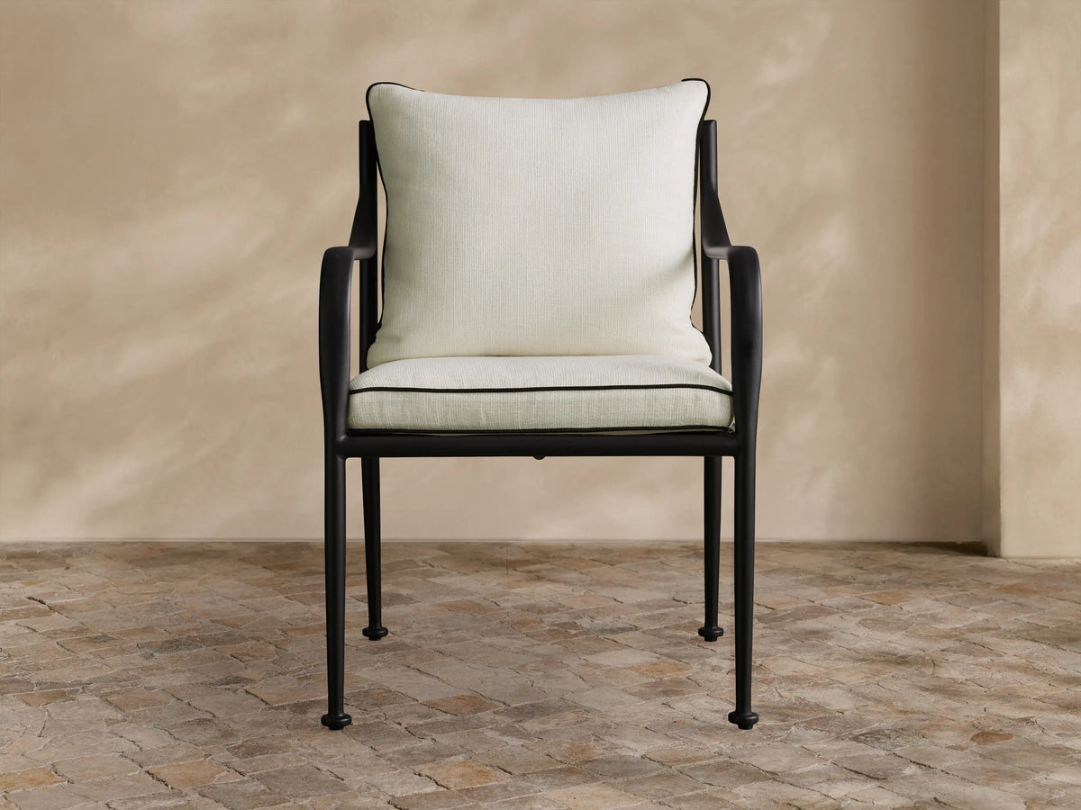 Light gray Surrey Outdoor Collection Cover, tailored for a chair, front view, textured fabric with V-seam and central pleat.