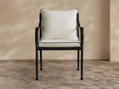 Light gray Surrey Outdoor Collection Cover, tailored for a chair, front view, textured fabric with V-seam and central pleat.