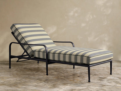 Front view of the beige and navy striped Surrey Outdoor Chaise, featuring a black aluminum frame and elevated back.