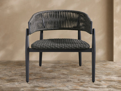 Talia Outdoor Aluminum Lounge Chair with a dark gray woven rope back and seat, on a powder-coated aluminum frame, angled right.