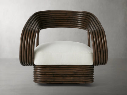 Plush white Valencia Outdoor Water-Repellent Replacement Cushion on a dark brown curved rattan chair, front view.