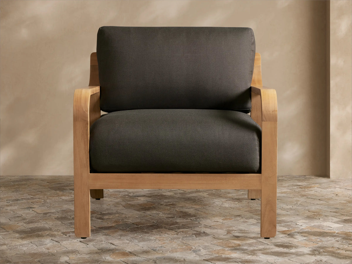 Front view of the Zoe Outdoor Lounge Chair with a natural teak frame and striped cushions.