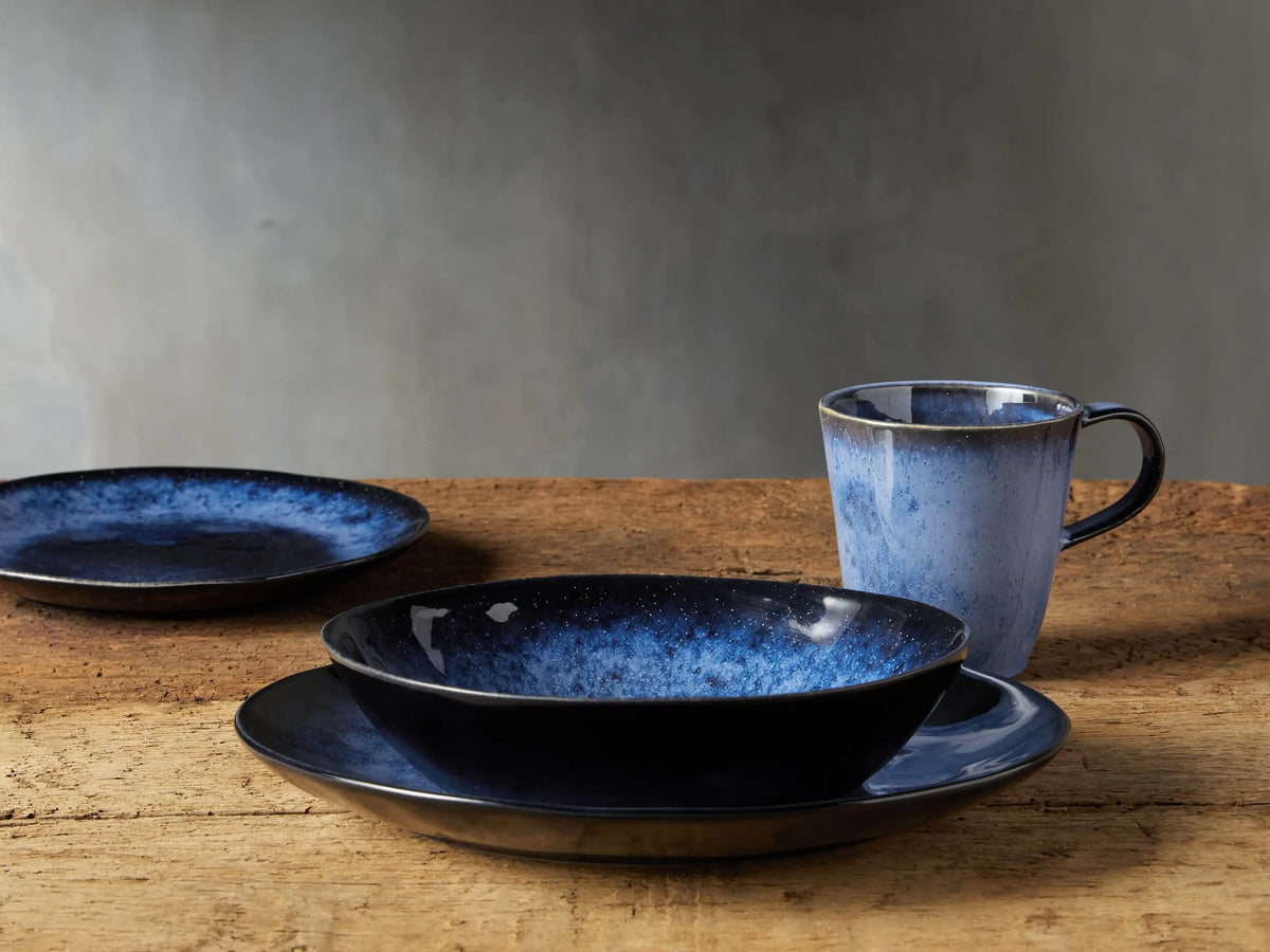 Twilight Mug with a close-up of indigo stoneware showing a rich, blue reactive glaze with slight variations.