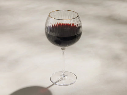 Front view of clear Anisa Red Wine Glasses, with ribbed glass and a gold hand-painted rim.