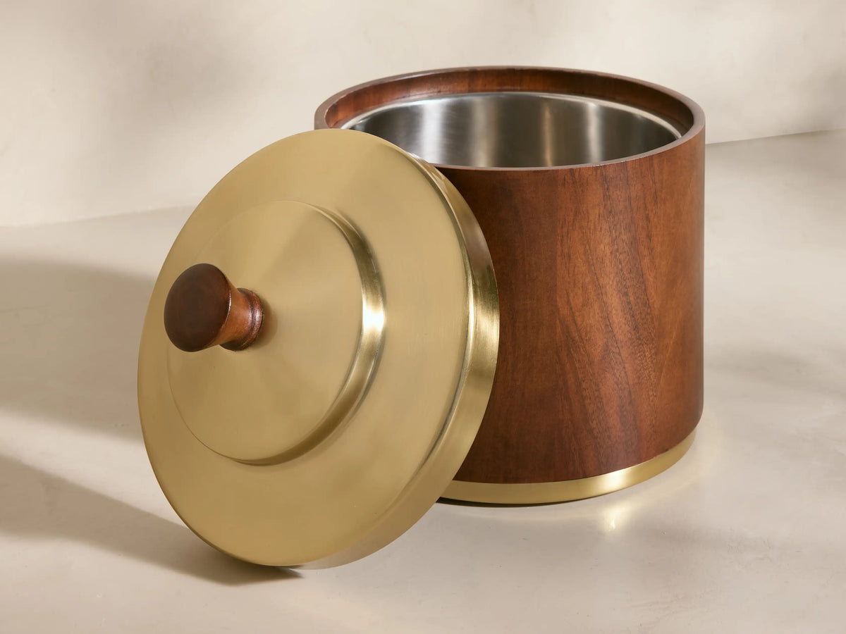 Front view of Errol Ice Bucket, dark brown wood body with a gold brass lid, wood knob handle, and brass base ring.