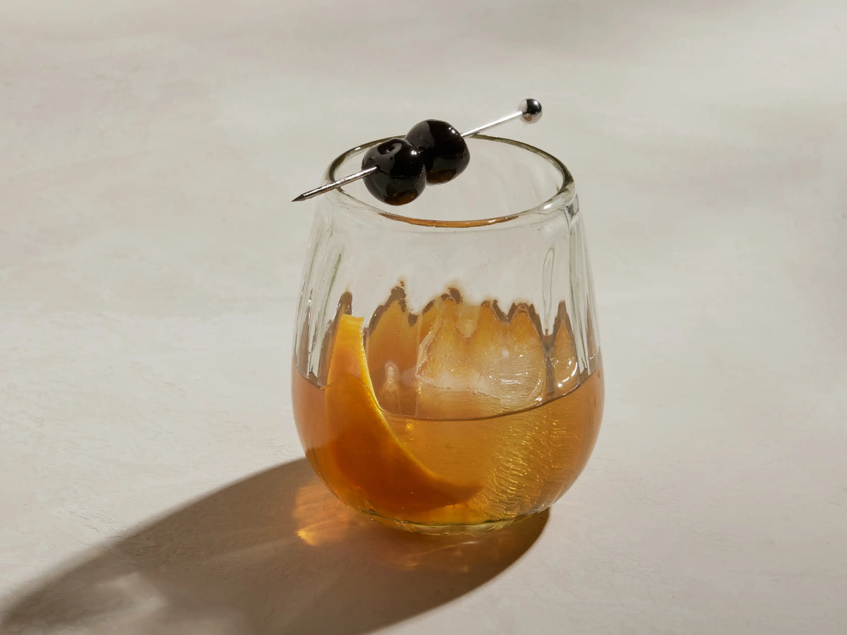 Seema Clear Double Old-Fashioned Glass, close-up, showing ribbed texture, organic rim, and recycled glass imperfections.