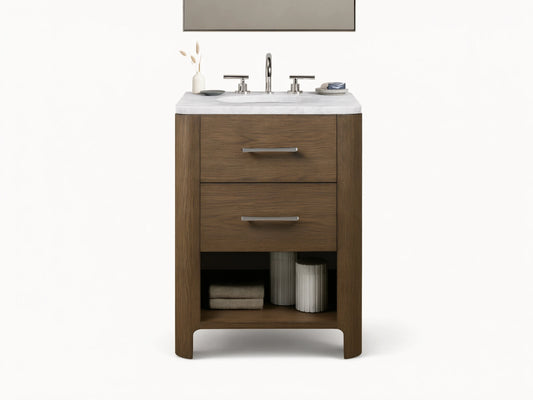 Calista Powder Vanity with oak frame, stone top, undermount sink, and two drawers, set in a neutral-toned bathroom scene.