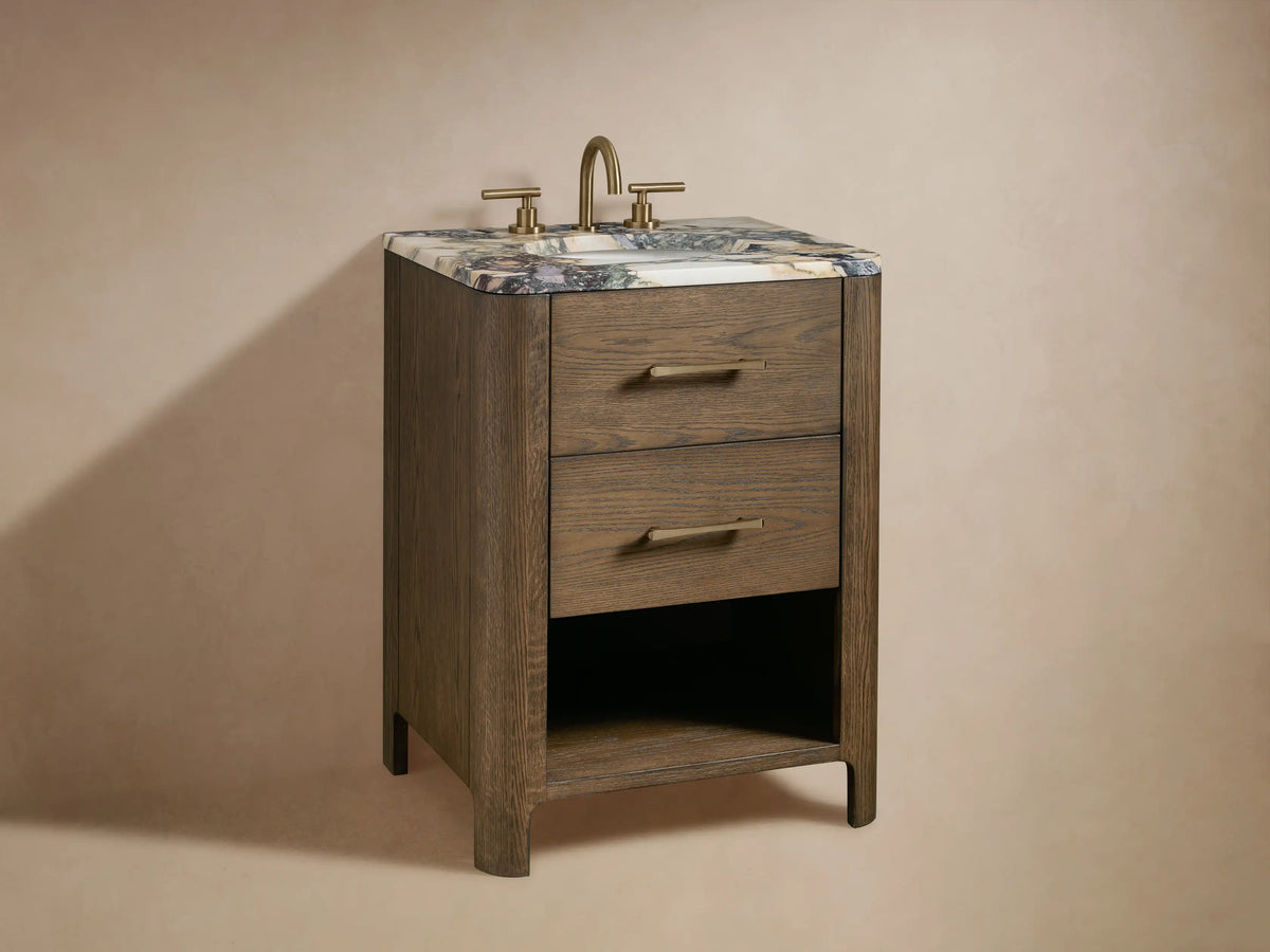 Oak wood vanity with open drawer displaying towels and bathroom items. Features metallic handle and visible wood grain texture.